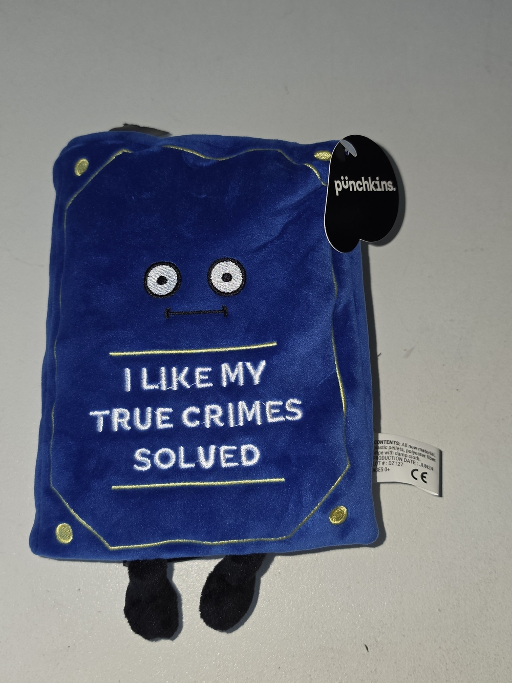 Blue Plush Book Pillow - "I Like My True Crimes Solved"